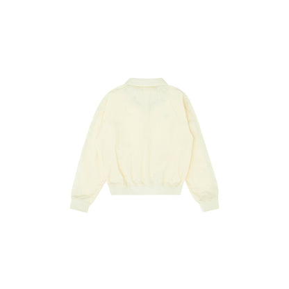 Back view of the Piv'vee Club Piste Top in soft ivory with a relaxed fit and elastic cuffs