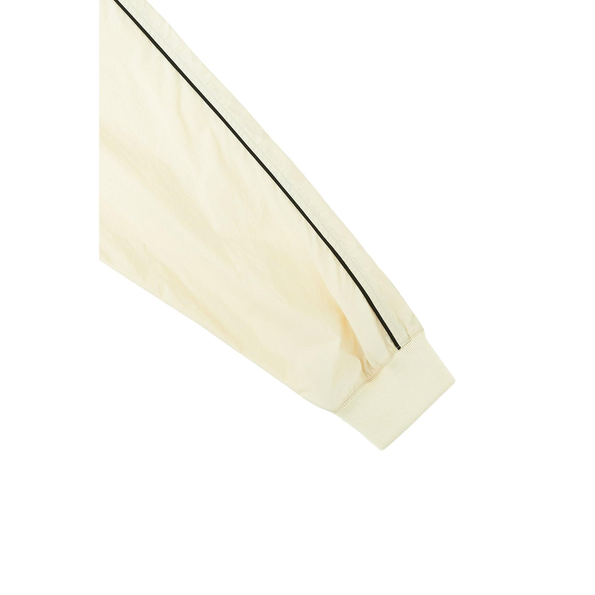 Piv'vee Club Piste Top in cream color with contrasting black stripes on the sleeves