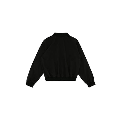 Back view of Piv'vee Club Piste Top in black with a relaxed fit and elastic hemline